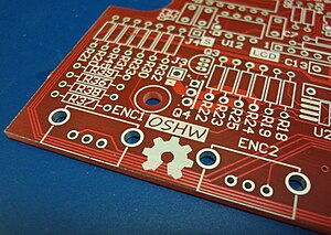 Open Source Hardware (OSHW) Logo on blank PCB.jpg