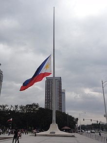The Philippine flag at Rizal Park, Manila, flown at half-mast on January 30, 2015, during the National Day of Mourning in the aftermath of the Mamasapano clash Philippine Flag in half-mast (Rizal Pak, Manila; 2015).jpg