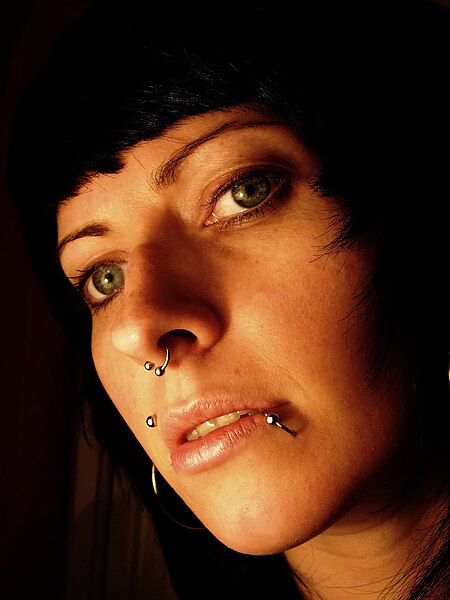 File:Portrait of dark haired girl with beautiful eyes and several piercings.jpg