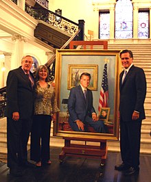 Romney and artist Richard Whitney at the June 2009 unveiling of Romney's official portrait in the Massachusetts State House. Romney at the unveiling.jpg