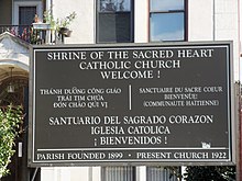 Sacred Heart's multilingual sign Sacred Heart DC sign.JPG