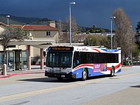 SamTrans ECR bus at Colma station, March 2018.JPG