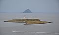 The isle of Pladda as seen from Arran, with Ailsa Craig in the distance