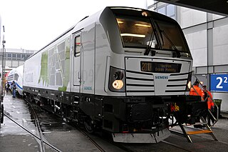 The Vectron is a locomotive series made by Siemens Mobility, introduced at the 2010 InnoTrans trade fair in four prototype versions: diesel, multi-system, and both AC and DC electric power. The diesel version has been replaced in 2018 by a dual mode locomotive which is powered by electricity on electrified sections of the track and can be switched to diesel mode on non-electrified sections. The Vectron series is reconfigurable and modular, with a Bo'Bo' wheel arrangement, and is intended as the successor to the EuroSprinter family of locomotives. A more affordable, basic version called Smartron was introduced in 2018.
