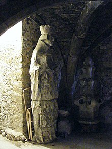 Statue of St. Swithun originally on the facade of Winchester Cathedral; now housed in the Crypt. St Swithun Statue.jpg