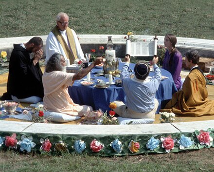 Interfaith service organized by Swami Satchidananda in 1975, Connecticut. Clockwise from the swami are Br. David, Fr. Beh, Taj Inayat, Roshi Prabhasa Dharma, Rabbi Gelberman.