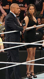Former WWE Chairwoman and CEO Stephanie McMahon (right) with her husband WWE CCO and Head of Creative Triple H (left) Triple H and Stephanie McMahon 2014.jpg