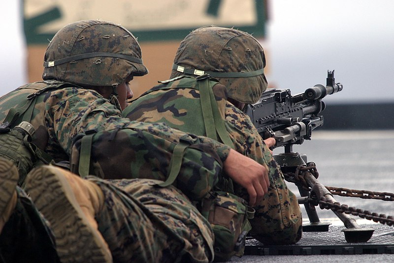 File:US Navy 040221-M-4806Y-005 Lance Cpl. Chris Grant fires a M-240G 7.62mm medium machine gun from the fight deck of the amphibious dock landing ship USS Fort McHenry (LSD 43).jpg