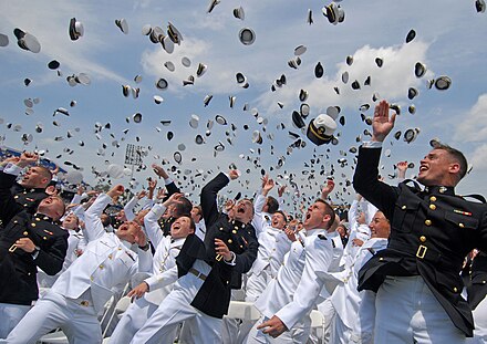 Newly commissioned officers celebrate their new positions by throwing their midshipmen covers into the air as part of the U.S. Naval Academy class of 2011 graduation and commissioning ceremony.