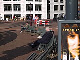 View over the brick square Waterlooplein and white building facade; free photo Amsterdam by Fons Heijnsbroek, 12-10-2021