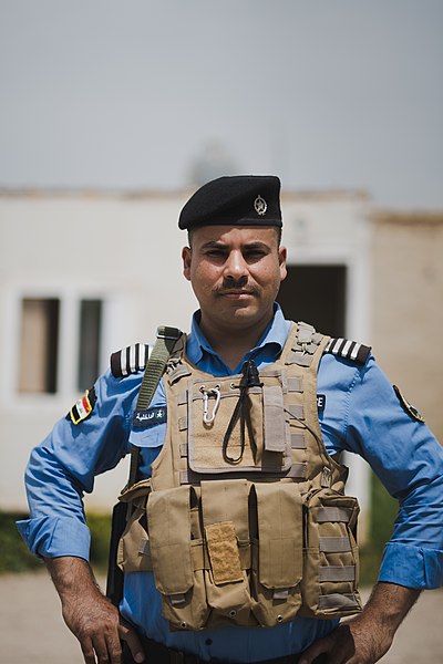 File:Views of Shia Kurdish police officer at the Shia shrine of Zakr Al-Deen in Shingal in April of 2019, following its destruction by the Islamic State 37.jpg