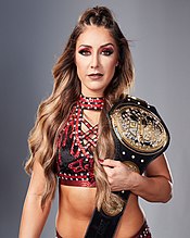 Dr. Britt Baker, D.M.D., with the 2021-2022 version of the championship belt WMC AEWBAKER-CHAMP.jpg