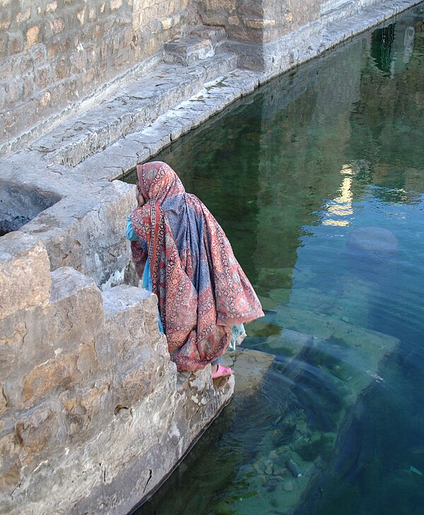 Local woman fetching water from a reservoir in Kawkaban