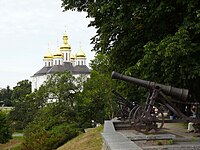 Cannon of 18th century on the shaft, with St. Catherine's Church in the background