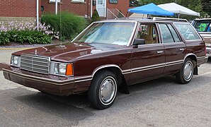 1982 Plymouth Reliant Custom wagon, front left (ISWC meet, July 15, 2023).jpg