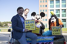 Men protesting outside Disney World in 2020 with a sign reading, "Save Our Kids from LGBT Indoctrination." 20-11-2019. 500.000+ signatures against LGTB in Disney. Orlando.jpg