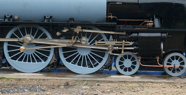 A set of Walschaerts valve gear on 60163 Tornado. Note that the radius bar is set to reverse.
