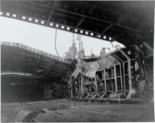 The upper hangar deck of Katsuragi, October 1945, after it was struck by a 2,000-lb bomb on 28 July. 80-G-351745 Japanese Aircraft Carrier KATSURAGI.tif