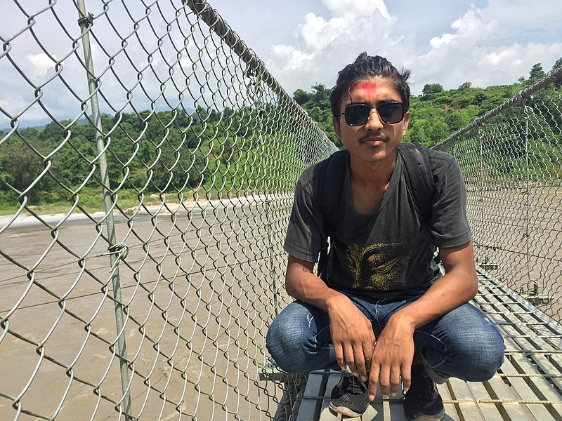 File:Abishek sitting on the bridge.jpg