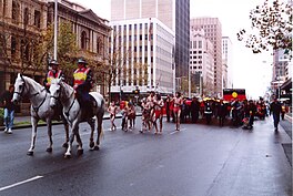 Marching from Parliament House down King William Street to Victoria Square/Tarntanyangga, Adelaide, to celebrate the 30th anniversary of the Aboriginal flag, 8 July 2001 Aboriginal Flag 30th anniversary event, Adelaide.jpg