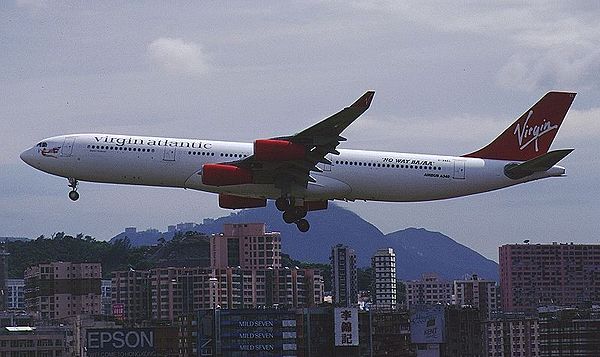 Airbus A340-300 landing at Kai Tak Airport, displaying the "No Way BA/AA" livery