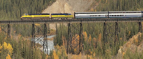 A Princess Tours train in 2007. Alaska Railroad SD70MAC and GP40 on bridge.jpg