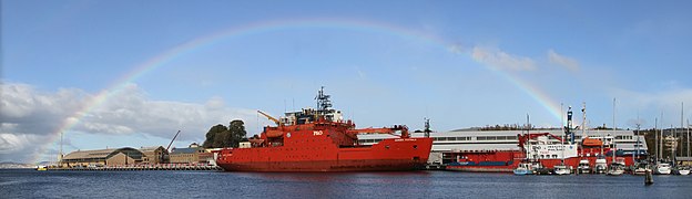 Aurora Australis (icebreaker) berthed in Hobart under a rainbow