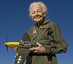 Betty “Tack” Blake, 91, holds a model of a P-51 Mustang (cropped).jpg