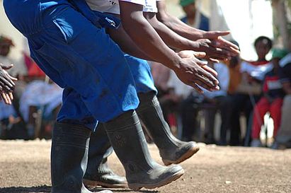 Gumboot dance evolved from the stomping signals used as coded communication between labourers in South African mines.