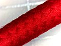 A close up of a red braided USB cable.