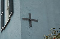 One of many "earthquake bolts" found throughout period houses in the city of Charleston subsequent to the Charleston earthquake of 1886. They could be tightened and loosened to support the house without having to otherwise demolish the house due to instability. The bolts were directly loosely connected to the supporting frame of the house. Charlestonbolt.JPG