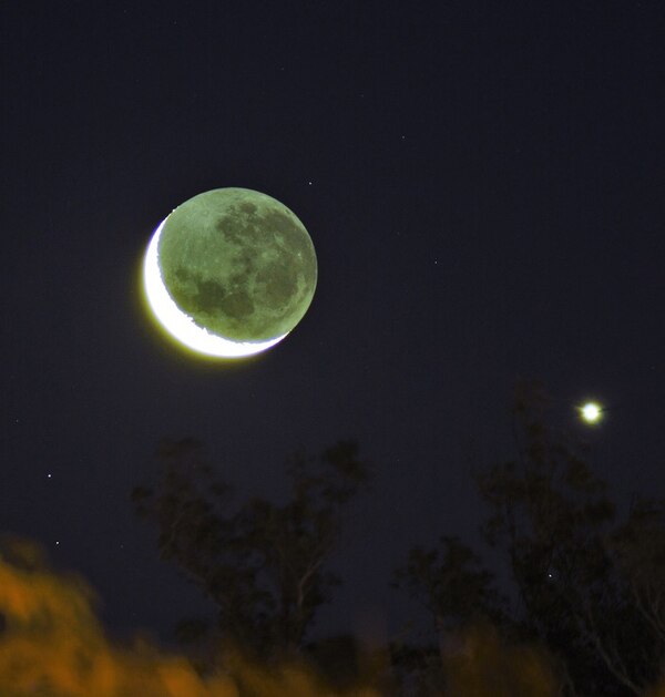Visual conjunction between the Moon and the planet Venus, the two brightest objects in the night sky