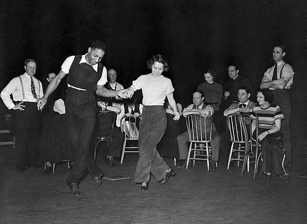 Choreographer Clarence Yates rehearsing Olive Stanton and the cast of The Cradle Will Rock (1937)