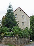 Residential house with portal and inscription plaque