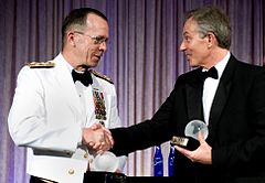 U.S. Navy Admiral Mike Mullen (in optional white semi-formal mess dress uniform) congratulates former British Prime Minister Tony Blair at the Atlantic Council of the United States Distinguished Leadership Award Gala (2008)