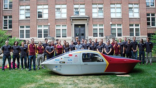 Members of UMNSVP pose with Eos II outside Lind Hall at the University of Minnesota. Eos II - Minnesota Solar Car.jpg