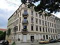 Apartment house in a corner and closed development