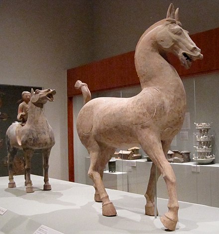 Ceramic statues of a prancing horse (foreground) and a cavalryman on horseback (background), Eastern Han dynasty (25–220 AD)