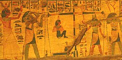 Meskhenet depicted as a birth brick in a Weighing of the Heart scene painted on a coffin