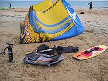Most kitesurfing equipment: LEI Kite with bag and pump, twintip board and harness, plus floatation vest and helmet, lacking only the bar and lines Kitesurf-devices.jpg