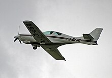 Lancair 235 during landing gear retraction sequence Lancair 235 G-BSRI (20031632811).jpg