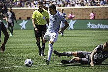 Daniel Salloi is a 2021 MLS All-Star. With over 170 appearances, he has more appearances for Sporting Kansas City than any other homegrown player for their organization. Minnesota United - MNUFC v Sporting KC - TCF Bank Stadium (28389364498).jpg
