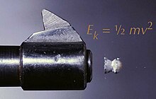 Pellet exiting muzzle, with formula for energy overlaid. Muzzle velocity.jpg