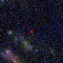 Color composite of JWST-NIRCam images showing GLASS-z12 as a red dot among other galaxies NASA-GLASS-z13-Context-JWST-20220722.jpg