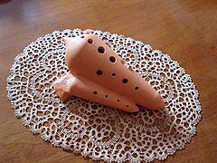A double-chambered transverse ocarina (mouthpiece on the side)