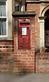 Edward VII wall-mounted postbox at the former post office