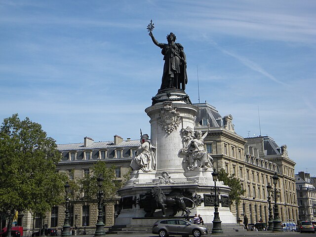 Monument à la République at the centre of the square, topped by a statue of Marianne