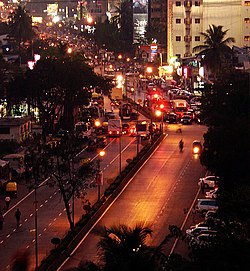 A city street in Jallah jeem with left-hand traffic