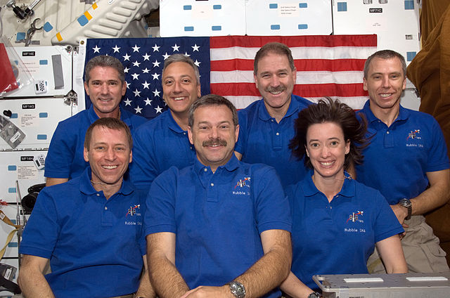 Altman (front center) with the crew of STS-125
