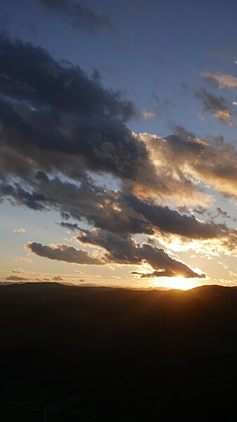 File:Sunset clouds hills.jpg